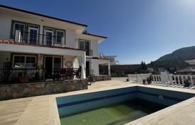 Villa in Uzumlu among mountains and forests, 20 km from Fethiye, with heating, pool, 4 balconies, fireplace, barbecue, parking, surveillance for $369,000